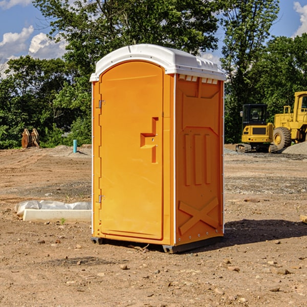 what is the cost difference between standard and deluxe portable toilet rentals in Holmesville